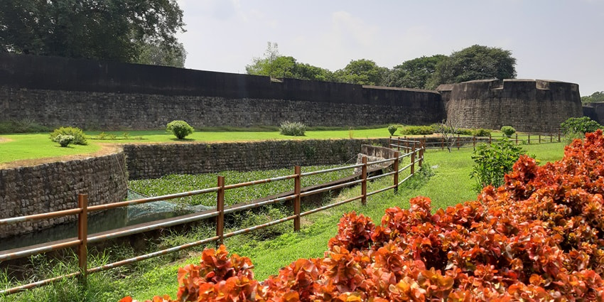 A view of the lush green gardens with flowers, situated on Palakkad Fort’s premises.