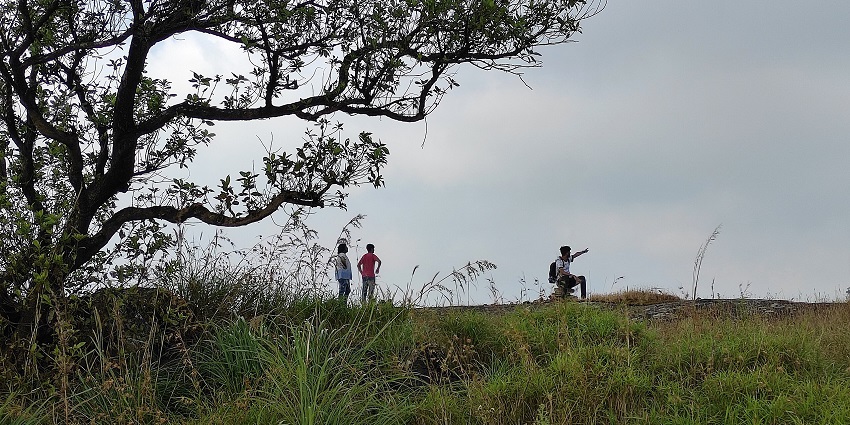 Image of Palkulamedu Viewpoint - people taking pictures and selfies amidst stunning lush green hill background