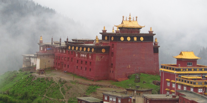View of Palpung Sherabling Monastery: serene Buddhist site with beautiful architecture.