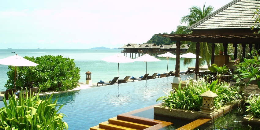 A poolside view of an island beach