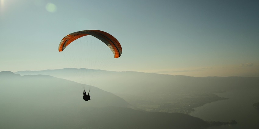 You will fly across pine-covered landscapes during your paragliding experience in Khajjiar.