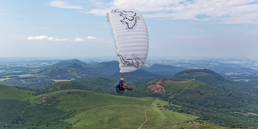 Birds eye view of hills beneath the clouds - Tent Camping in Vagamon