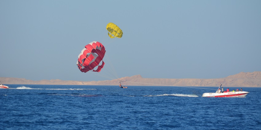 Unveil the adventure with Parasailing on Elephant Beach under the guidance of professionals.