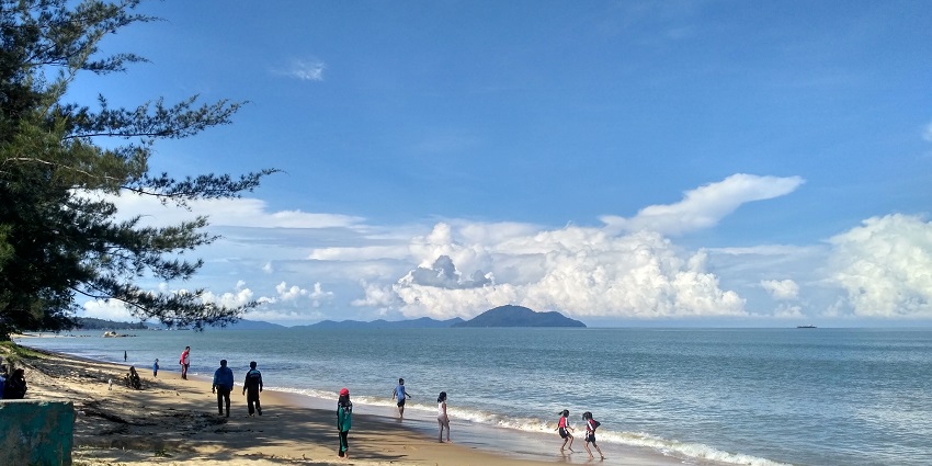 The gorgeous views of sandy beach and clear waters of Pasir Panjang Beach, Singkawang.