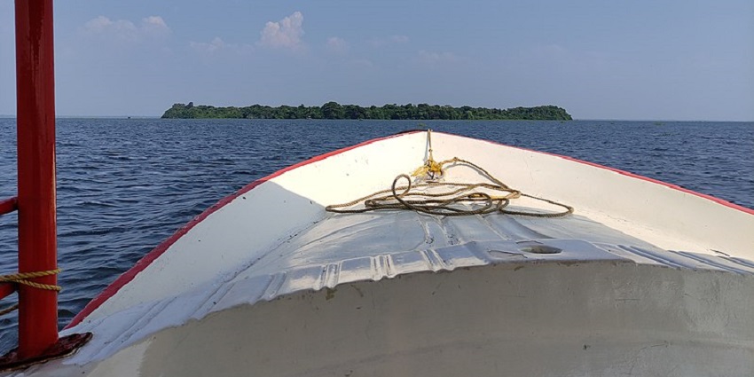 A view of Pathiramanal Island from a boat
