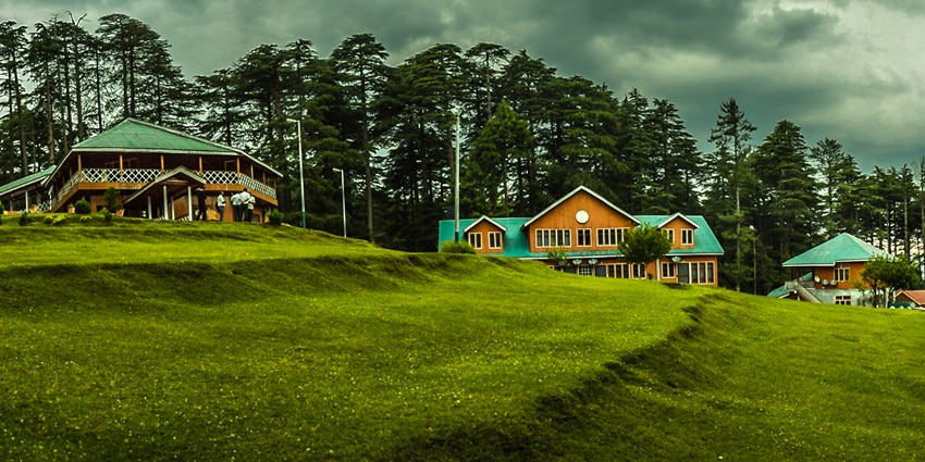 A scenic picture of a resort in Patnitop with views of protected forests in the background