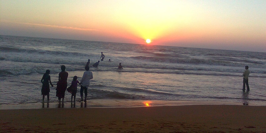Witnessing the beautiful sunset and the cold breezes from the ocean at Payyambalam beach