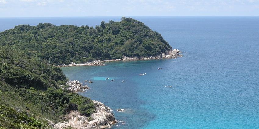 A breathtaking view of the Perhentian Islands with turquoise waters and lush greenery.