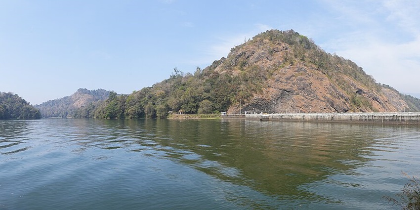 Serene water body surrounded by lush greenery - best hill stations near Thrissur
