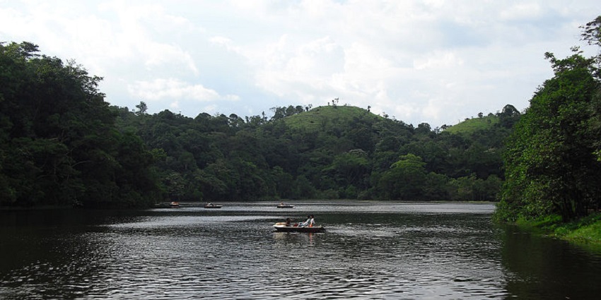 people enjoying boat rides in a lake