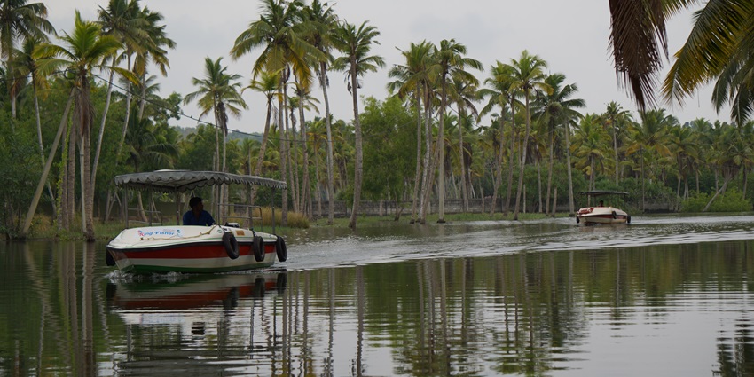 Image of a houseboat in Poovar Island under clear blue sky - places to visit near Kerala State Science And Technology Museum