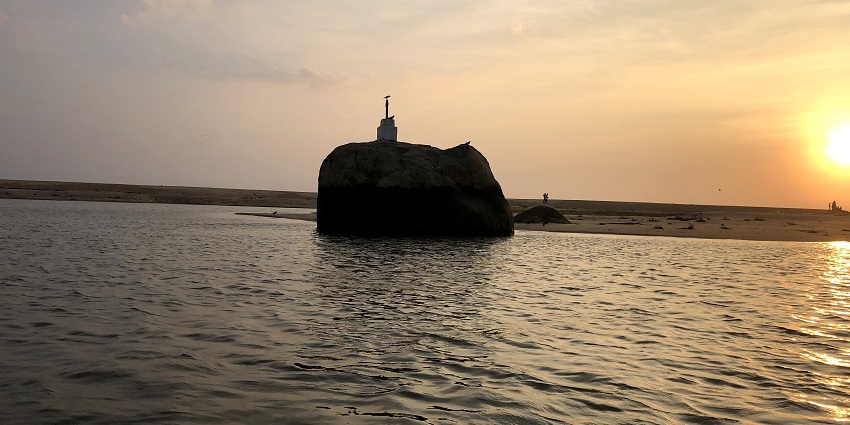 A sunset view of the Elephant Rock (shaped like an elephant) on Poovar Island in Kovalam