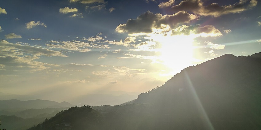 See the mesmerising sunsets at the western ghats at the Pothamedu View Point, Kerala.