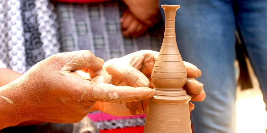 Image of Close-up Hands making pottery - explore pottery village in Bekal