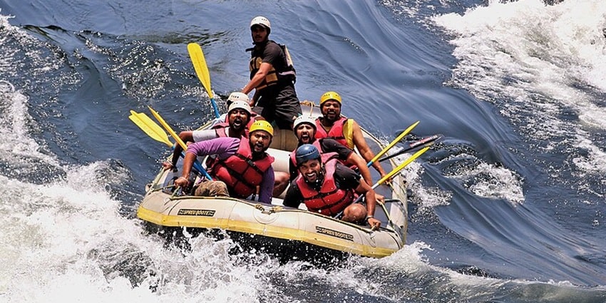 Group of people rafting in a river