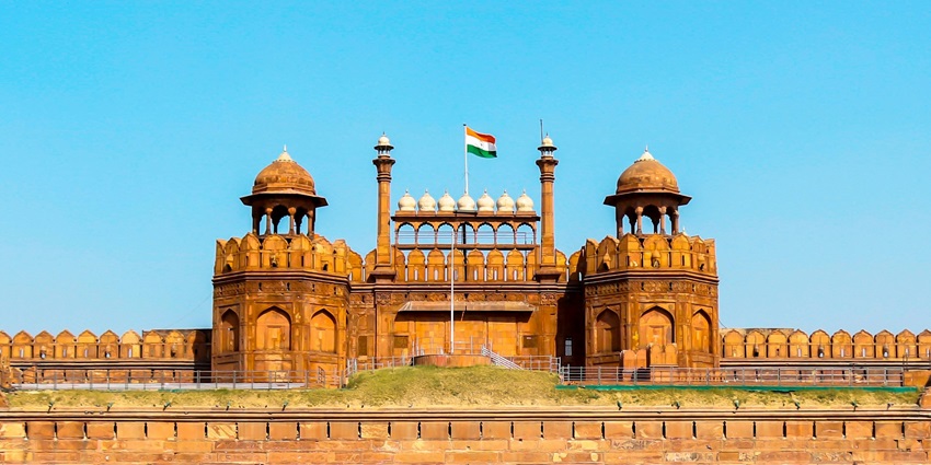 Frontal view of the Red Fort with the Indian Flag hoisted on top & clear sky in background