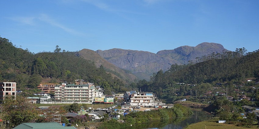 Soothing wide-angle shot of the resort with the backdrop of a beautiful hill, Kerala