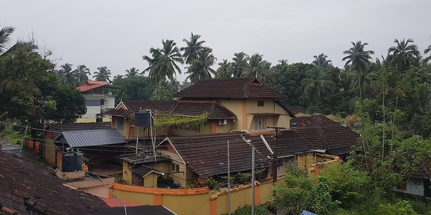 Aerial view of a beautiful resort in Palakkad, surrounded by the green lush forest