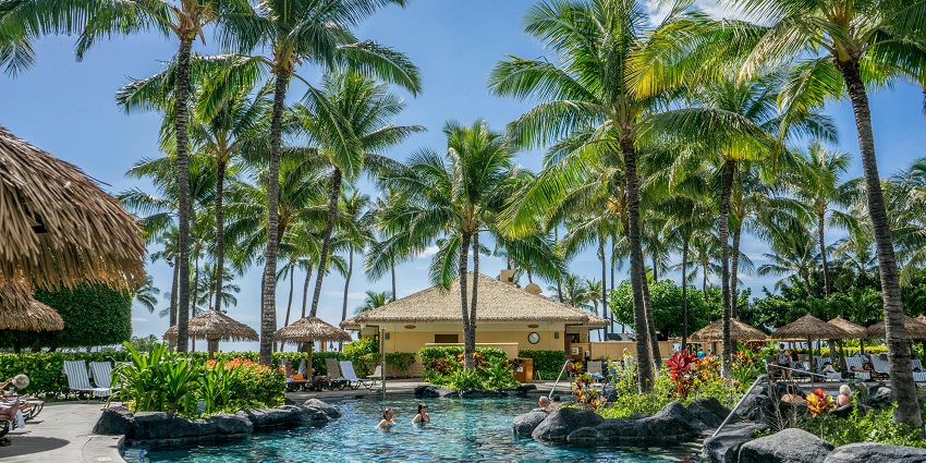 Resort near the beach, featuring stunning ocean views and direct access to sandy shores.