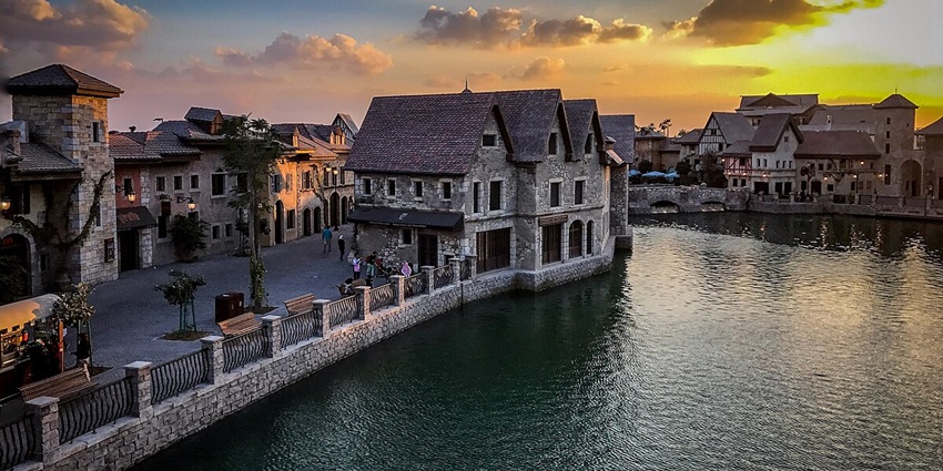Wide shot of resort and canals of Riverland - Theme park in Dubai, UAE