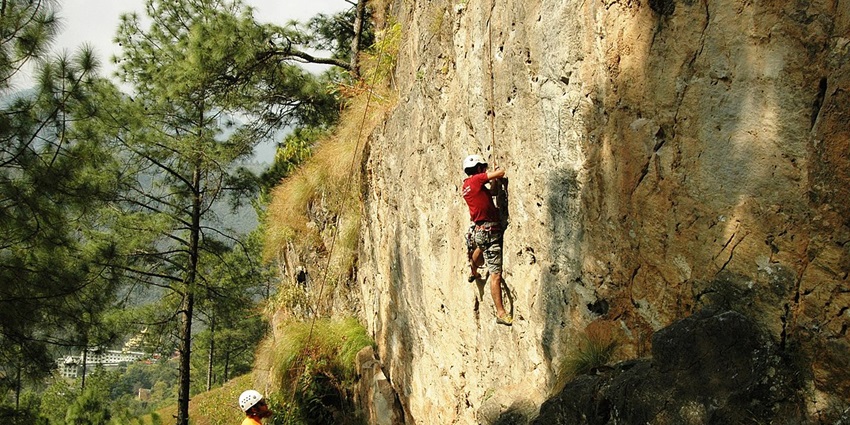 A group of three climbers clicked while trying adventurous rock climbing in Nepal