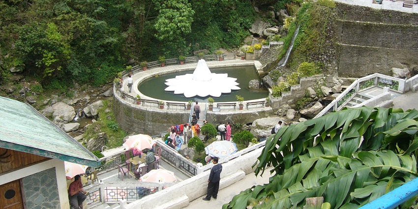 Picturesque view of Darjeeling Rock Garden, featuring terraced gardens and waterfalls.
