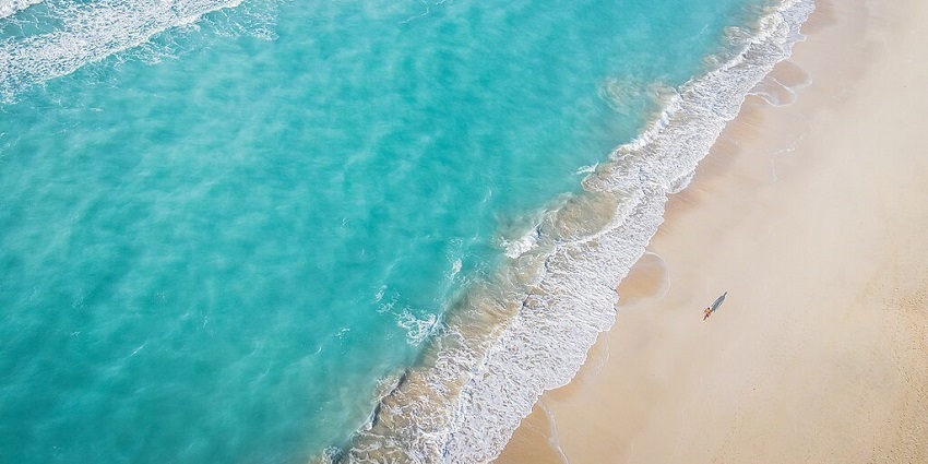 A mesmerising view of Saadiyat beach with crystal azure waters during the daytime.