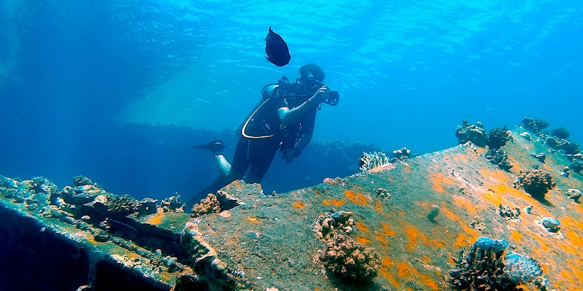 Scuba diving in Varkala's clear waters - one of the best water sports in Kerala.