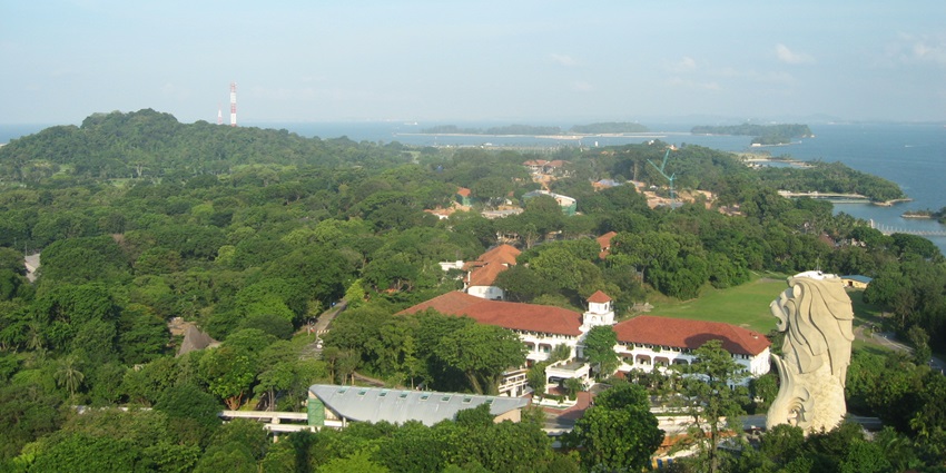 A breathtaking lush green view of Sentosa Island with azure waters on all the sides.