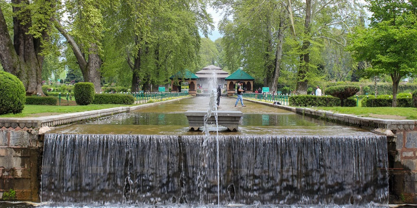 A breathtaking view of verdure and fountain at Shalimar Bagh, a Mughal garden in Srinagar