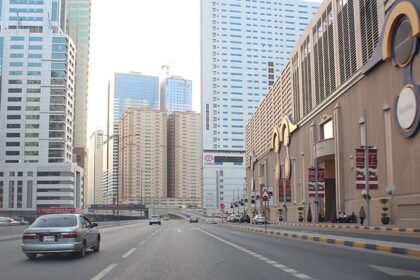 Al Nahda, Sharjah: urban landscape with modern buildings and bustling streets.