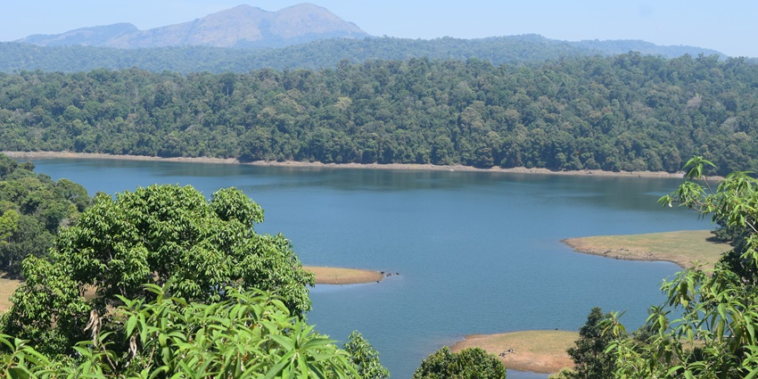 Expansive water body surrounded by lush hills - places to visit near Narangathode Waterfall