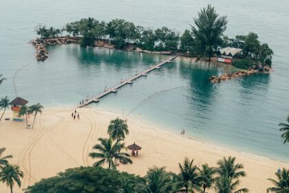 A stunning landscape of Sentosa Island in Singapore covered with lush green trees.