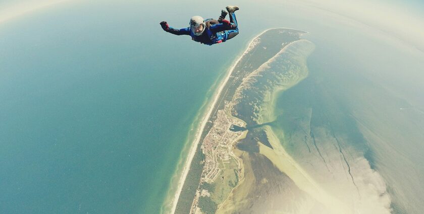 A person indulging in a thrilling adventure of skydiving, one of the top activities.