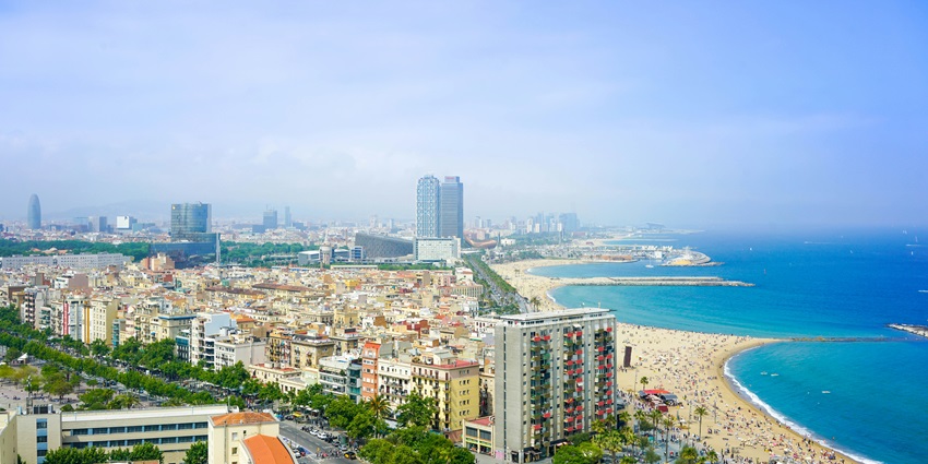An aerial view of people enjoying at the Barcelona City Beach, a famous place in Spain