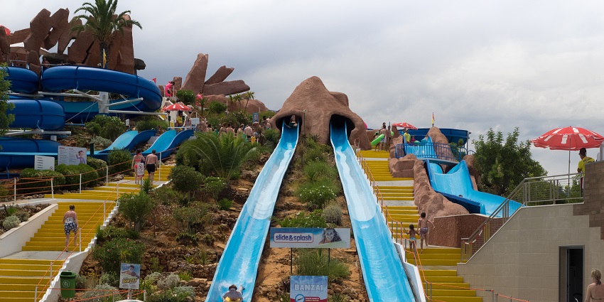 People enjoying water slides