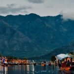 Scenic view of Dal Lake in the foreground and popular Srinagar temple you can visit.