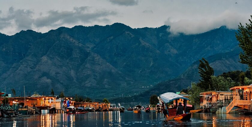 Scenic view of Dal Lake in the foreground and popular Srinagar temple you can visit.