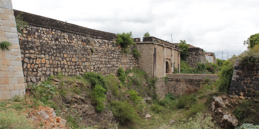 A scenic view of Srirangapatnam Fort with an intriguing background of cloudy skies
