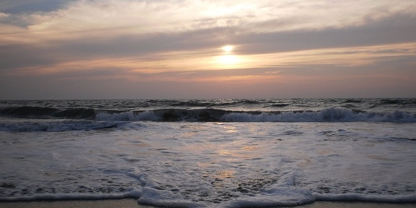Enjoy the sunset at Cherai Beach, one of the scenic places to visit in Kerala