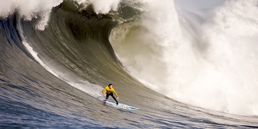 Picture of a surfer, riding on a wave in Ocean - Water sports in Varkala