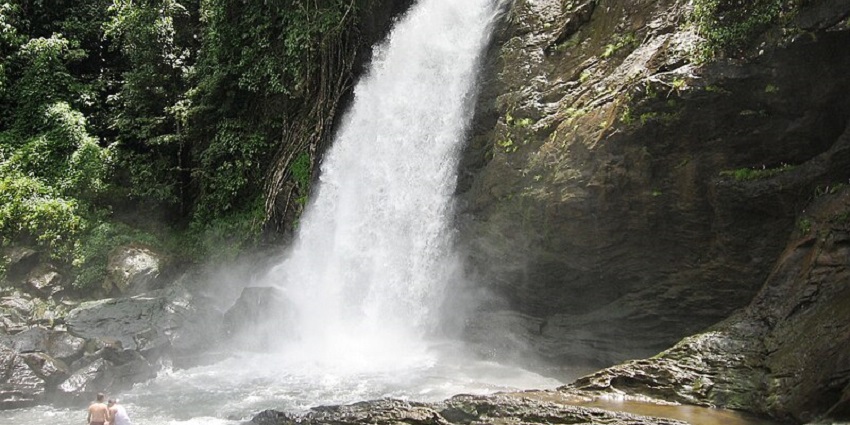 People enjoying a bath near Soochipara Waterfalls