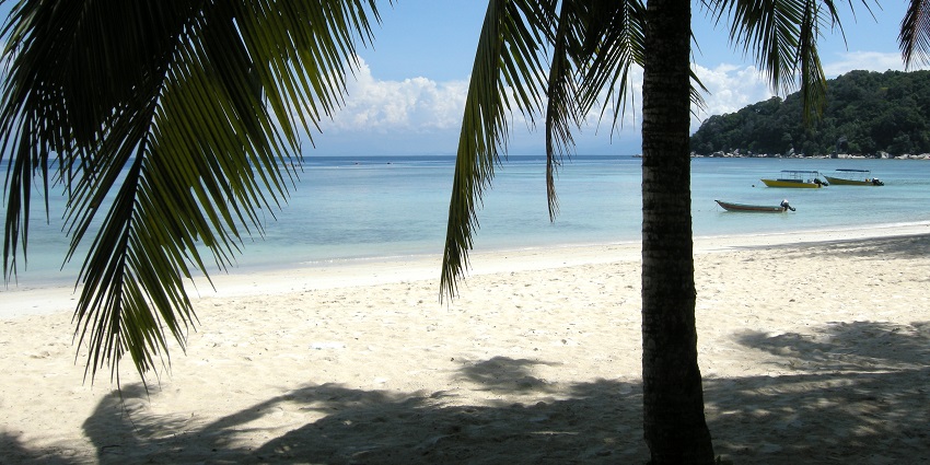 Enjoy the beautiful views and serene environment from Teluk Bahang Beach in Malays