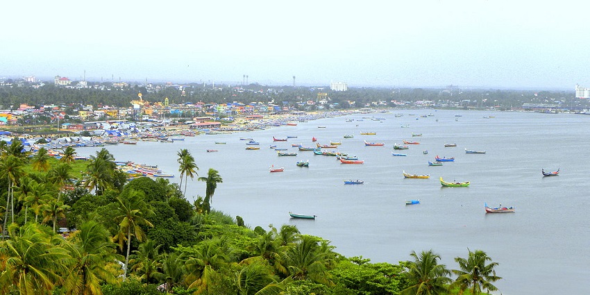 Magnificent wide-angle snapshot of the Thangasseri beach dockside housing colourful boats