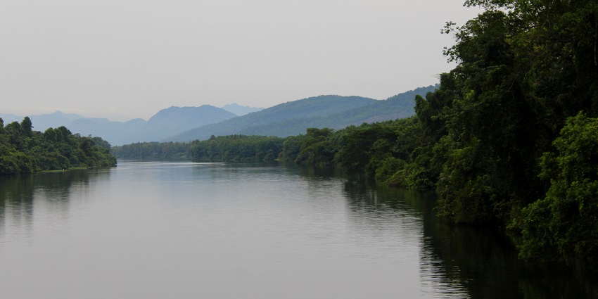 Serene river flowing through lush greenery in Kerala - hill stations in Ernakulam