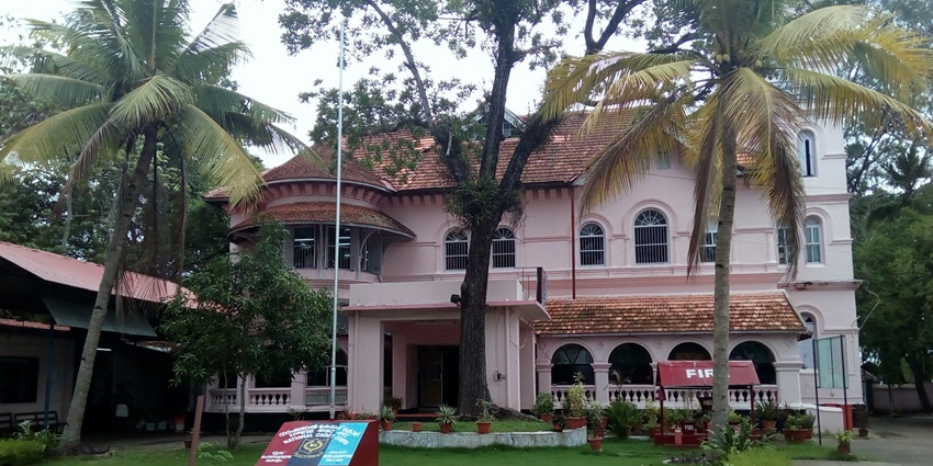 Explore a serene view lush green garden of Thevally Palace with things to do in Kollam