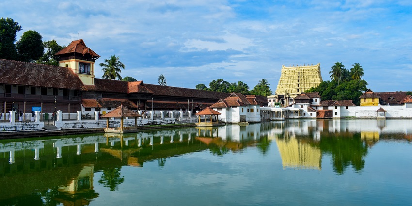 A picture of a majestic temple in Thiruvananthapuram with its reflection in a pond