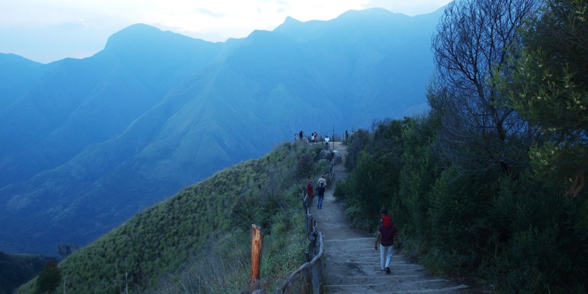 A serene view of the Top Station featuring majestic mountains and challenging trails.