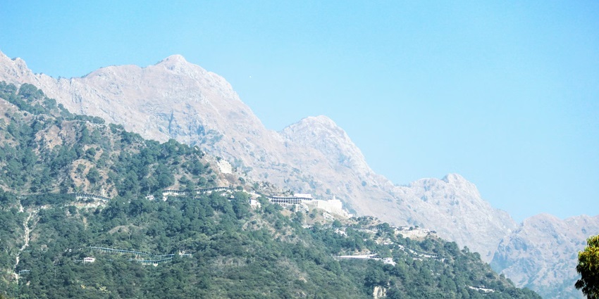 Mesmerising view of the three-peaked Trikuta mountain covered with lush green trees
