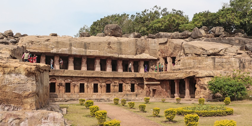 Caves, Odisha Alt Text: Group of people exploring Rani Gumpha of the Udayagiri Caves